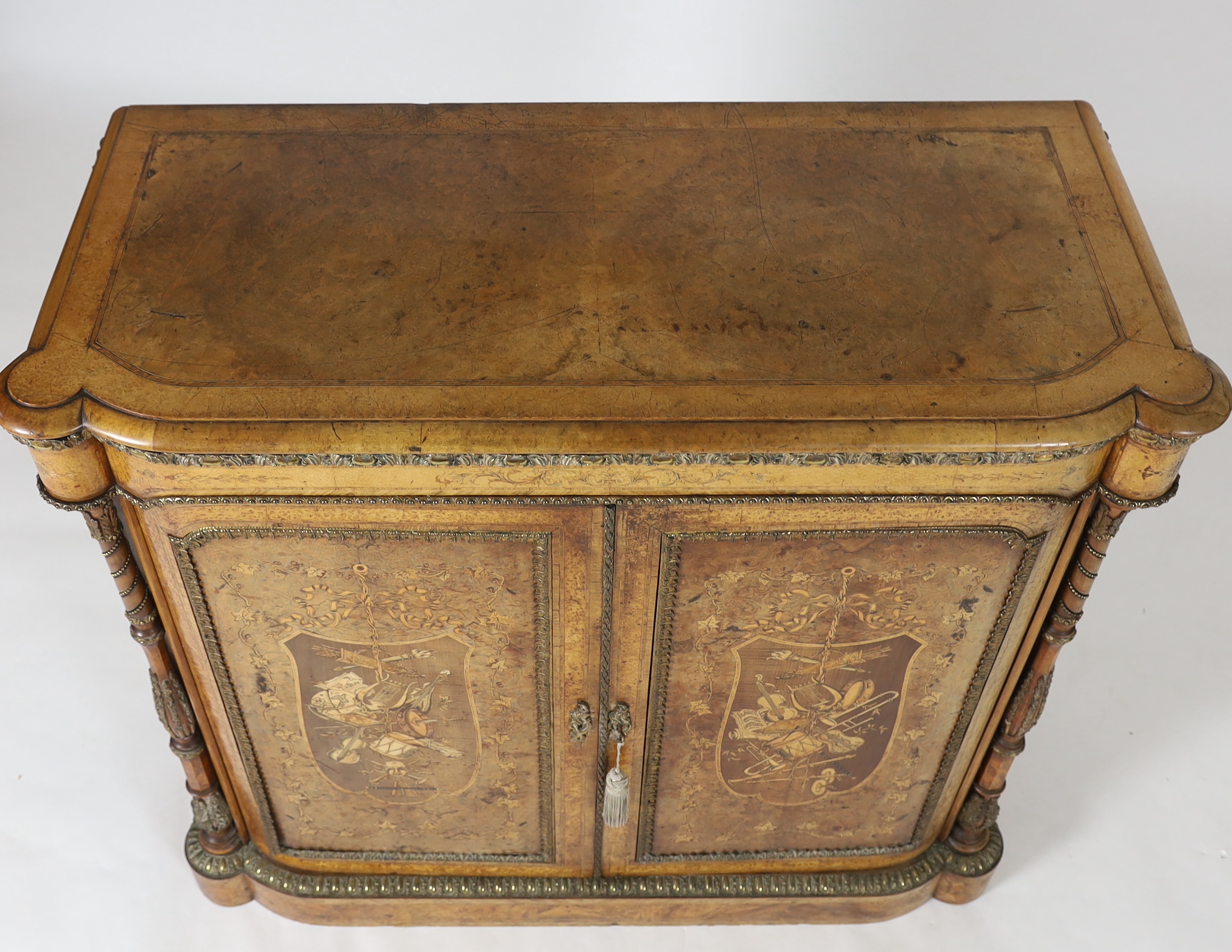 A Victorian marquetry inlaid burr walnut side cabinet 112cm wide, 48cm deep, 104cm high